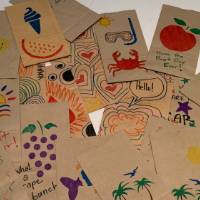Completed lunch bags decorated by CECI faculty and staff members pile #5